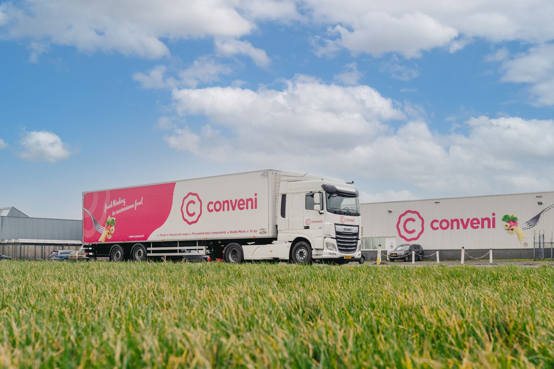Conveni truck in front of facade