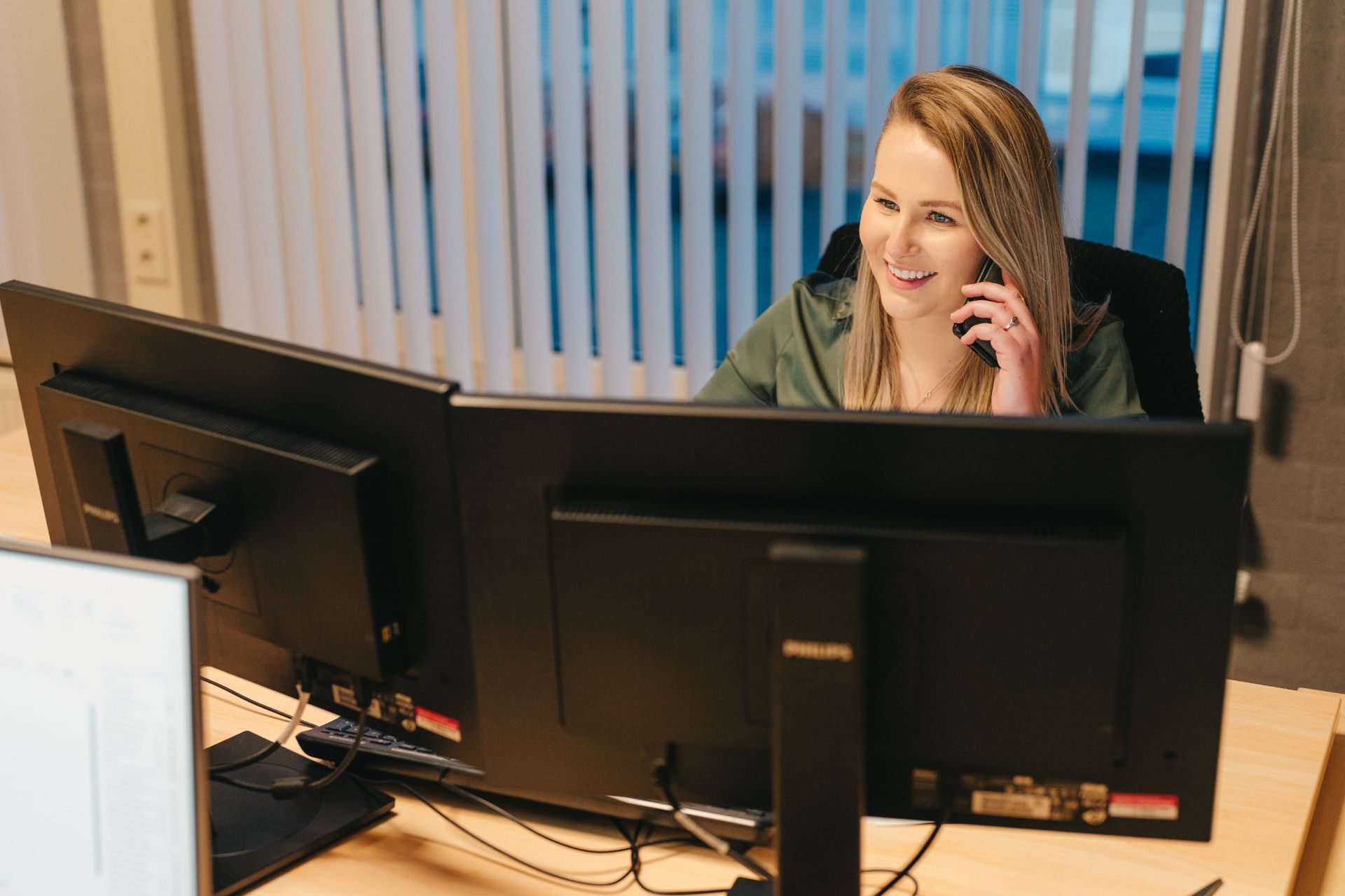 Woman calls with a smile